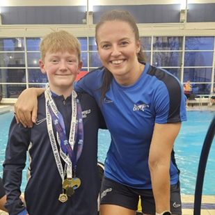 James with his gold medals at the pool