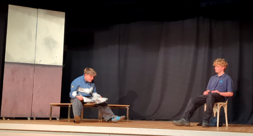 Two GCSE drama students performing on stage