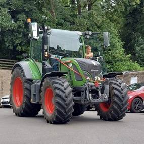Year 11 student arriving at prom on a tractor