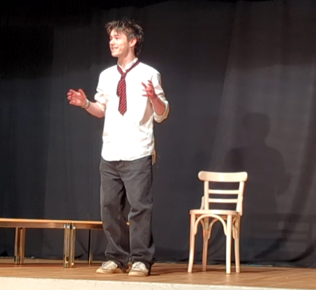 GCSE drama student performing on stage